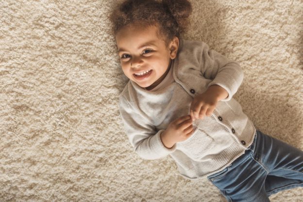 child on newly cleaned carpet